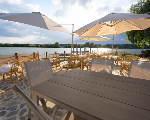 sunset-resort-waterfront-terrace-table
